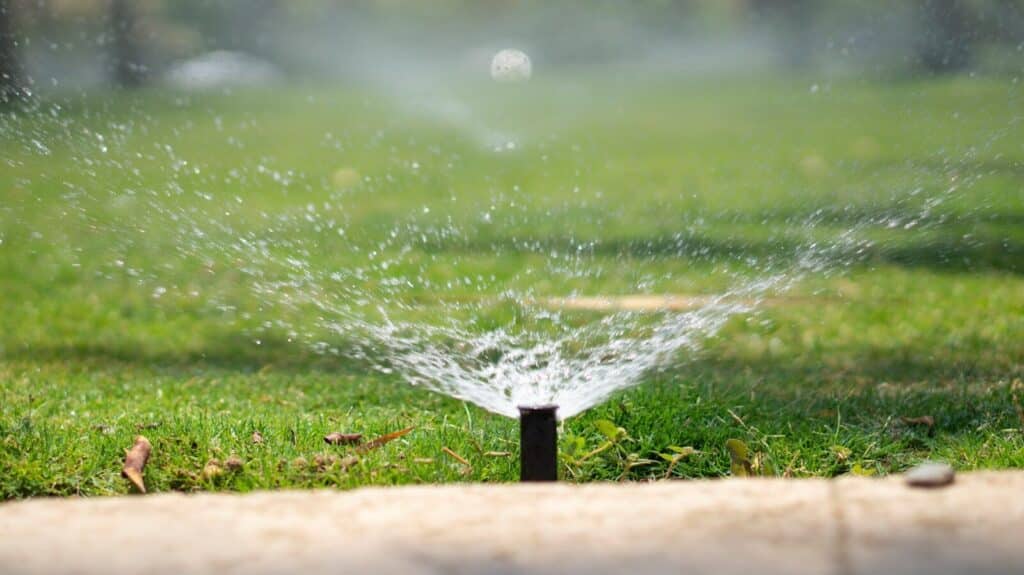 water splash on brown wooden post